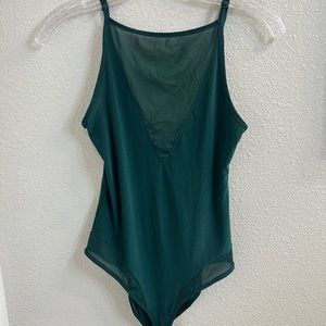 Teal body suit with mesh panels